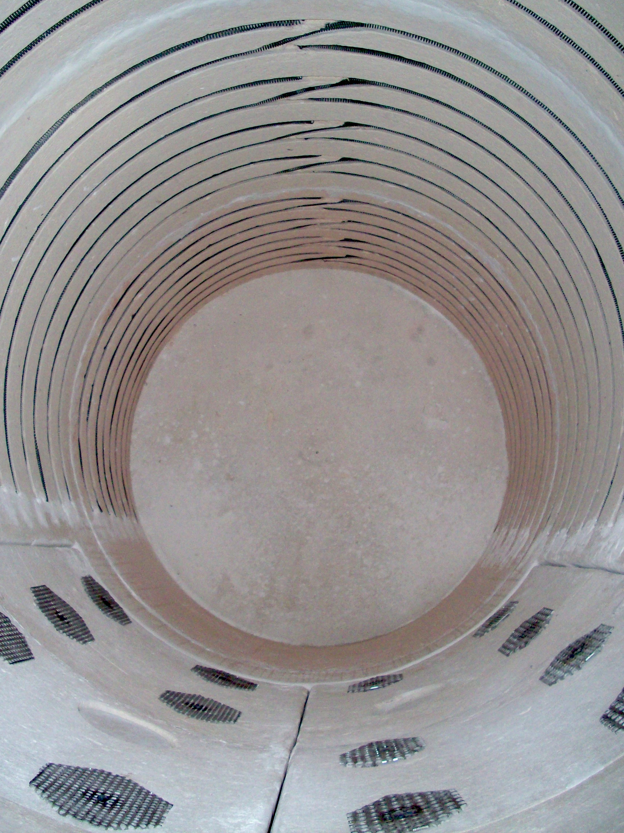 Interior refractory lining with embedded heating elements prior to final assembly.